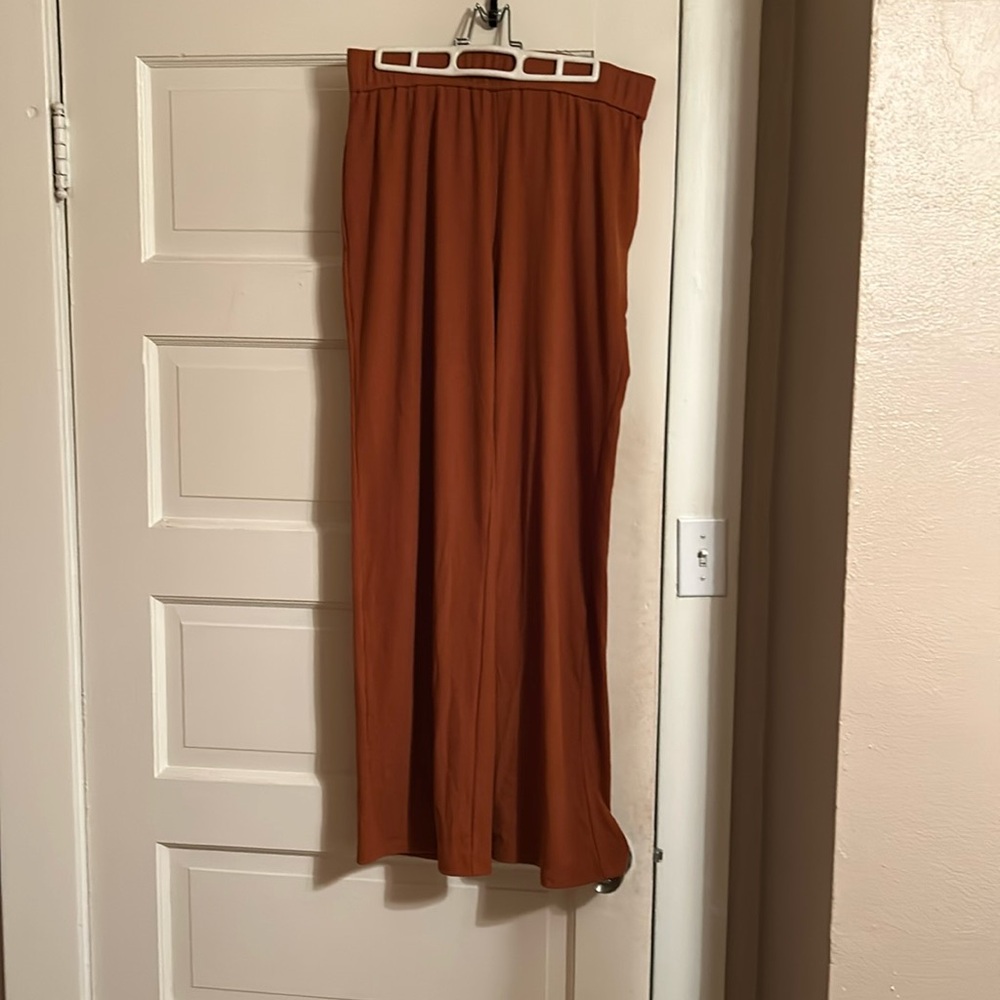 Iman 2 piece rust set, pants ribbed wide leg, size medium, top has some bling